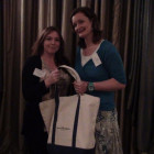 Caroline Hoyle of STA Travel wins a Sunrise Marketing goody bag presented by Denis Greene